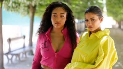 Jordyn Woods Wearing a Pink Outfit with Kylie Jenner Wearing a Yellow Jacket in Paris