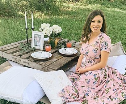 Lauren Duggar Sits at Picnic Outside in the Grass