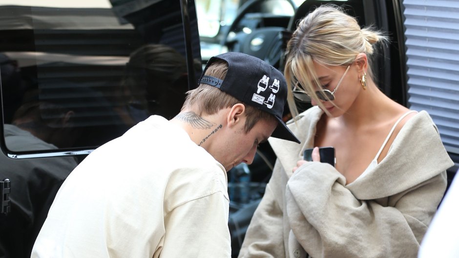 Justin Bieber Wears Drew House Tshirt and Tan Shorts While out in Beverly Hills With Hailey Baldwin in Jean Shorts and a White Tank Top and Sunglasses