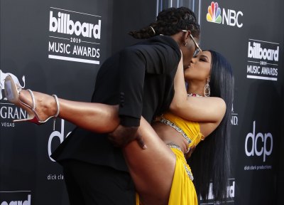 Cardi B Wearing a Yellow Dress With Offset in a Tuxedo