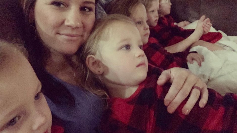 Danielle Busby Cuddles Daughters on the Couch