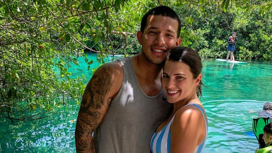 Javi Marroquin and Lauren Comeau Smile for Photo in Front of Water