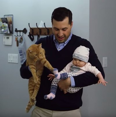 Jeremy Vuolo Holding Baby and Orange Cat