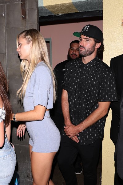 Brody Jenner In Button Down and Cap Outside Night Club With Girlfriend Josie Canseco Wearing a Tight Gray Romper