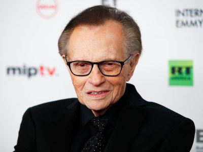 Larry King Wears Black Suit and Glasses on Red Carpet