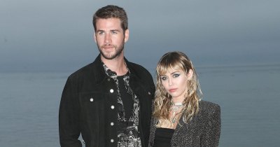 Liam Hemsworth and Miley Cyrus Stand In Front of Water
