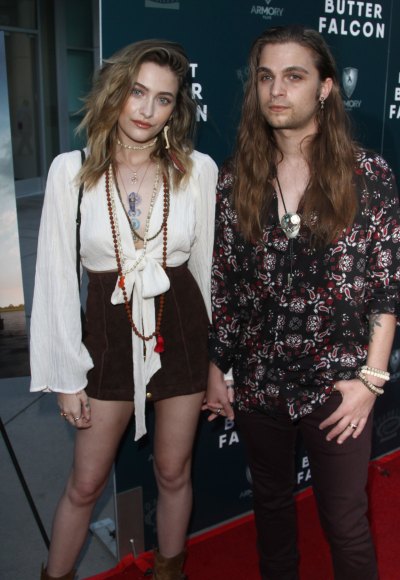 Paris Jackson Wearing a White Top With Shorts on a Carpet and Her Boyfriend Gabriel Wearing a Patterned Shirt