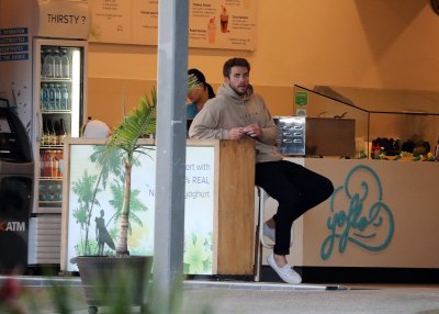 Liam Hemsworth In a Cafe With a Hoodie On
