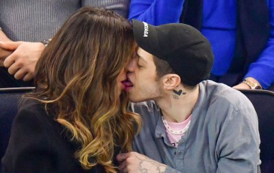 Pete Davidson and Kate Beckinsale kissing at a hockey game