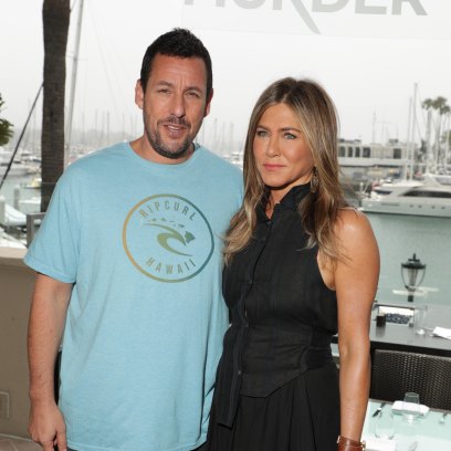 Adam Sandler Wearing a Blue T-Shirt With Jennifer Aniston Wearing a Black Dress