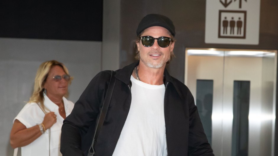 Brad Pitt Wearing a White T-Shirt with Sunglasses in Japan