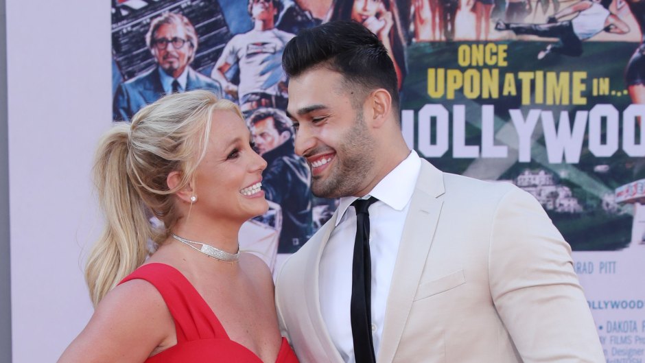 Britney Spears Wearing a Red Dress With Sam Asghari in a White Suit at an Event
