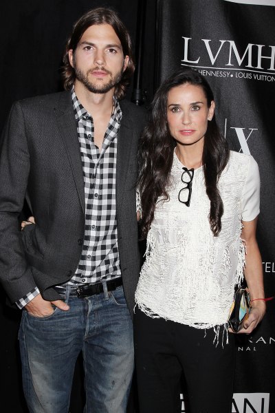 Ashton Kutcher Wearing a Plaid Shirt With Demi Moore in a White Shirt