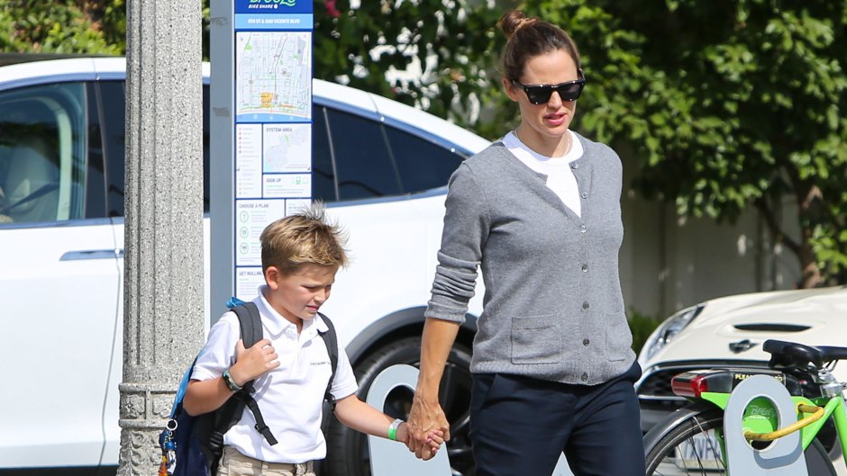 Jennifer Garner tends to Monday duties as she picks up son Samuel from school with a smile