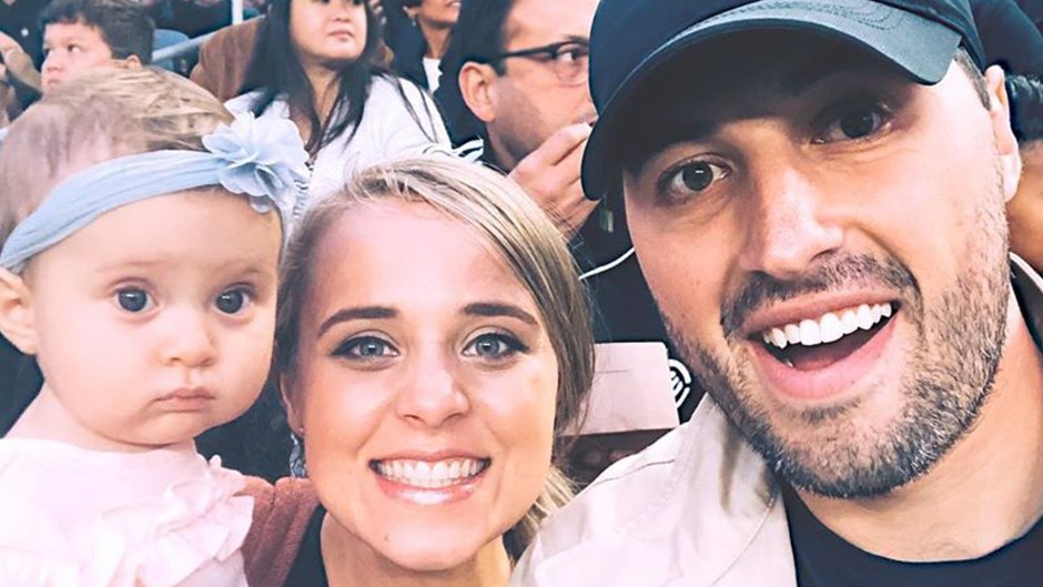 Selfie of Jinger Duggar and Jeremy Vuolo Smiling Holding Their Baby at a Game