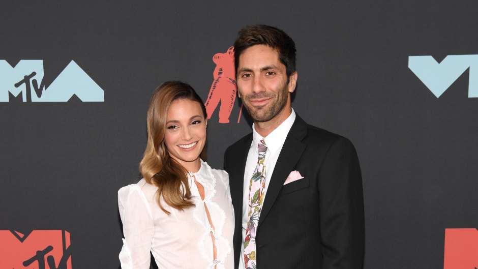 Laura Perlongo Wearing a White Shirt With a Black Skirt with Husband Nev Schulman Wearing a Suit at the MTV Music Awards
