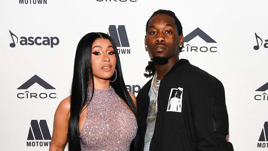 cardi b wears a taupe silver sparkly fitted long gown with a high neck and high thigh slit while offset wears black pants, a blue and white t-shirt and a black jacket at the ASCAP Rhythm & Soul Awards 2019