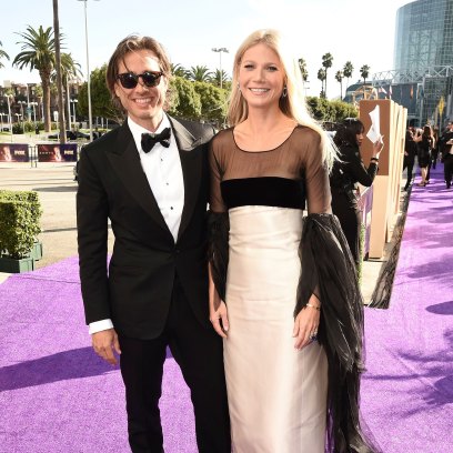 gwyneth paltrow wore a cream and black color blocked gown while her husband brad falcuk wore a classic black and white tuxedo on the 2019 emmys red carpet