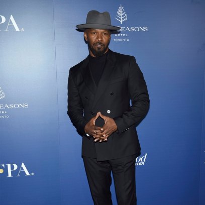 jamie foxx wears an all black suit and a gray hat at the HFPA and THR TIFF Party