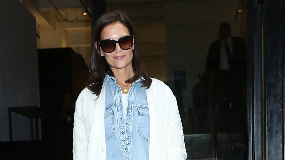 katie holmes wearing a white tee under a blue denim button down shirt under a white sweater with black leather pants and black high heeled boots at the Elie Tahari Spring 2020 Runway Show katie holmes attends elie tahari spring 2020 runway show at nyfw 2019