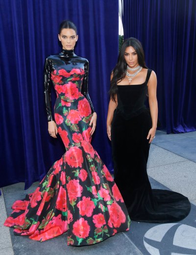 kim kardashian wears black gown and kendall jenner wears black and red gown onstage at the 2019 emmys 