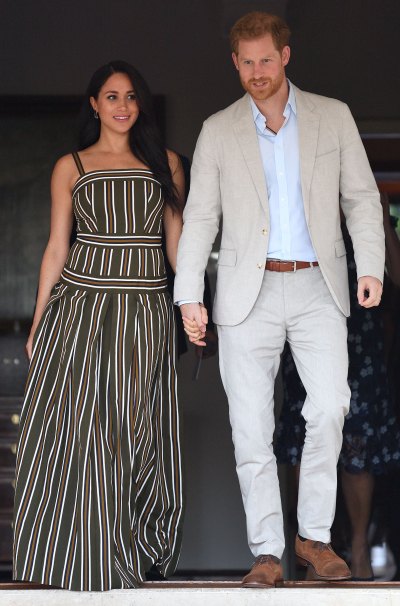 meghan markle and prince harry walking during africa trip.jpg