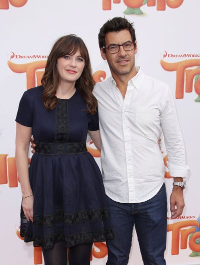 zooey deschanel wore a navy blue a-line dress and jacob wore a white button up shirt with jeans at the 'Trolls' film premiere, Los Angeles in October 2016 zooey deschanel and her estranged husband jacob pechenik
