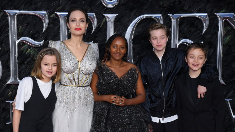 Angelina Jolie Wearing a Silver Dress With Her Kids
