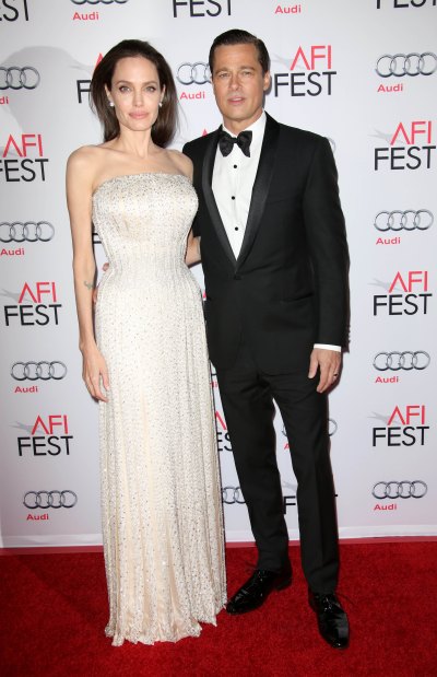 Angelina Jolie Wearing a White Dress With Brad Pitt in a Tuxedo