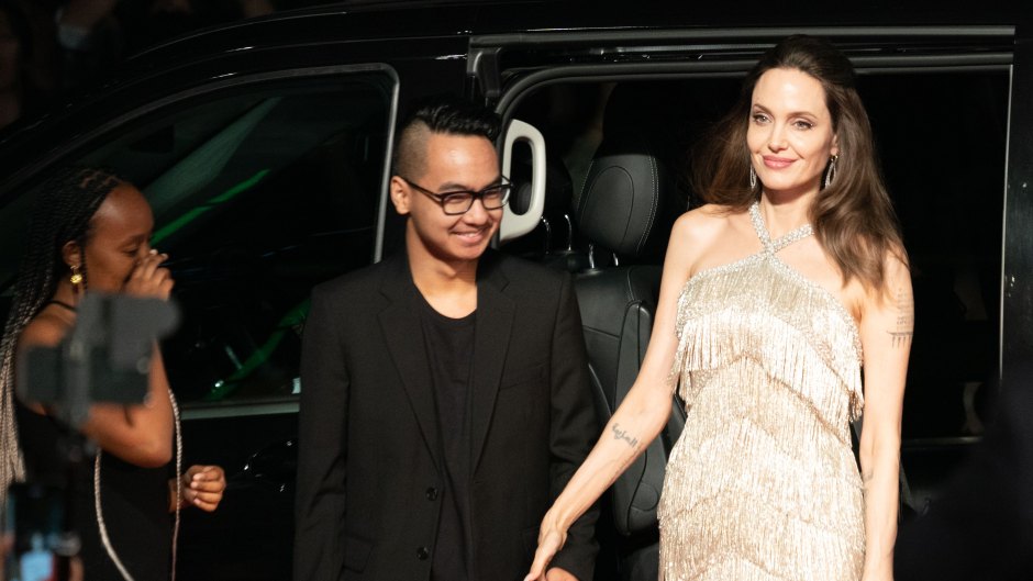 Angelina Jolie Wearing a White Dress holding Hands With Son Maddox in Japan