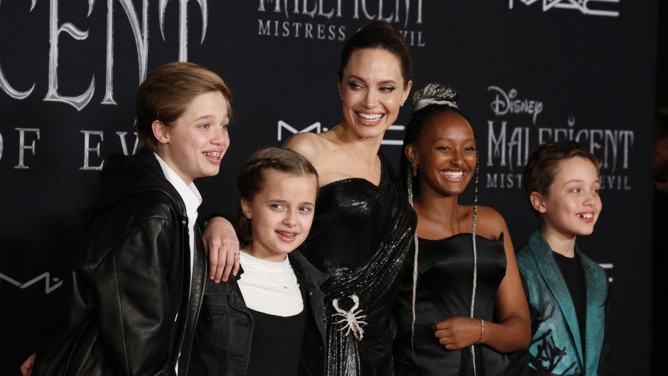 Angelina Jolie Wearing a Black Dress With Her Kids at a Premiere