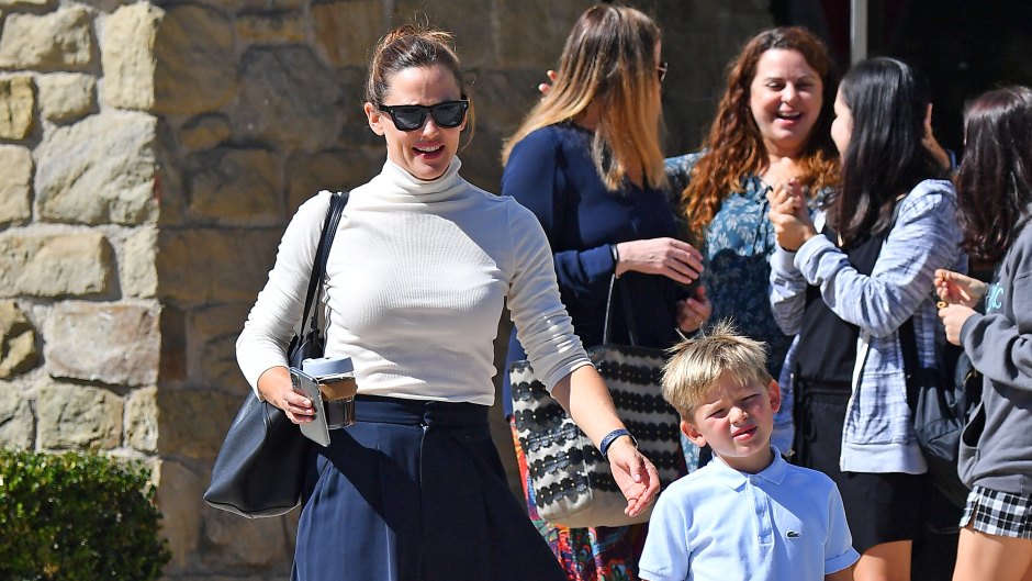 Jennifer Garner Wearing a White Top With a Blue Skirt With Her Son at Church