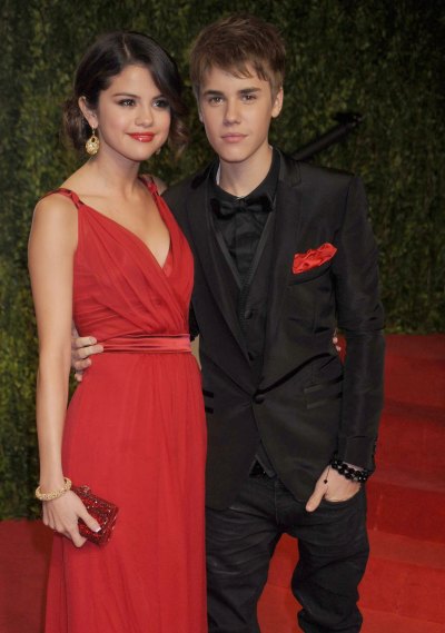 Selena Gomez Wearing a Red Dress With Justin Bieber on a Red Carpet