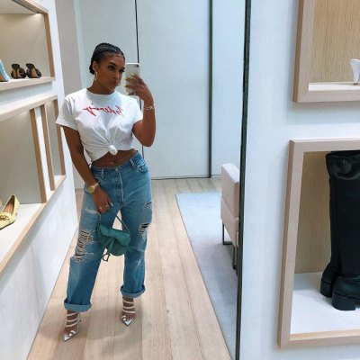 Lori Harvey Wearing Jeans and a White T-shirt Taking a Mirror Selfie