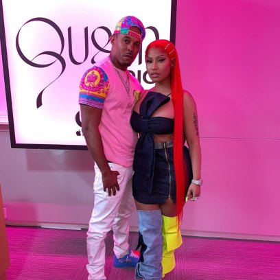 Kenneth Petty Wearing Jeans and a t-Shirt With Nicki Minaj in a Black Dress