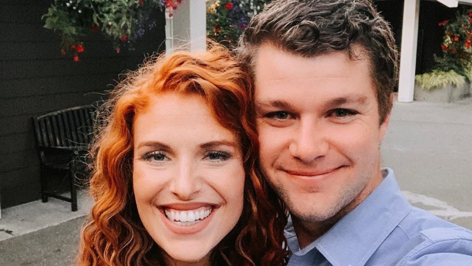 audrey and jeremy roloff smiling at camera with flowers behind them