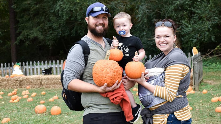 maddie brown and caleb brush holding their kids and pumpkins