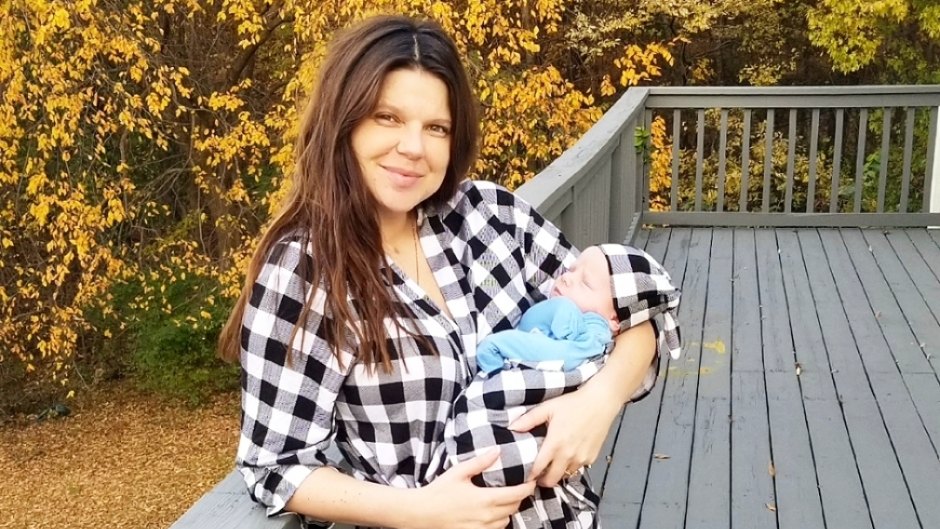 amy duggar holding her son dax wearing matching plaid