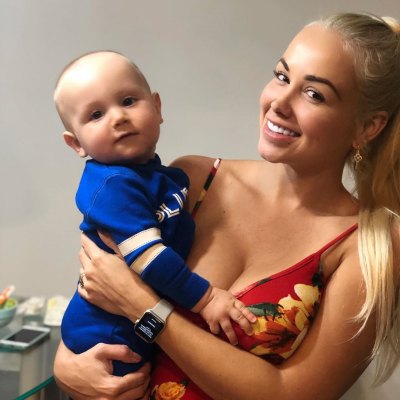 paola mayfield holding her baby son axel