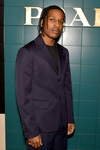 ASAP Rocky Wearing a Suit in Front of a Green Wall