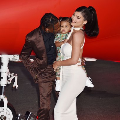 Kylie Jenner Wearing a White Dress With Stormi and Travis Scott