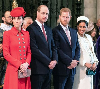 Kate Middleton Wearing Red Coat and Hat, Prince William Wearing Navy Suit White Shirt and Red Tie, Prince Harry Wearing Navy Blue Suit White SHirt and Pink Tie, Meghan Markle Wearing Off-White Coat and Hat Prince William ‘Secretly Relieved’ Prince Harry and Duchess Meghan Won’t Be Joining Christmas Festivities