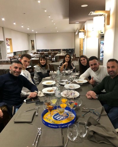 Joe Giudice Far Right SittingAround Table with Friends In Italy