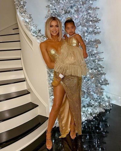 Khloe Kardashian With True Thompson in Gold Dresses