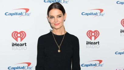 katie holmes looked sexy in an all black ensemble with a high-low cropped long sleeve black top and black leather pants
