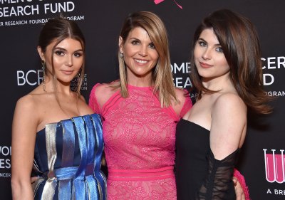 lori loughlin poses at a red carpet event with daughters olivia and isabella