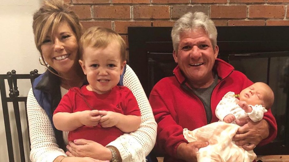 matt roloff and caryn chandler take family photo holding jackson and lilah roloff
