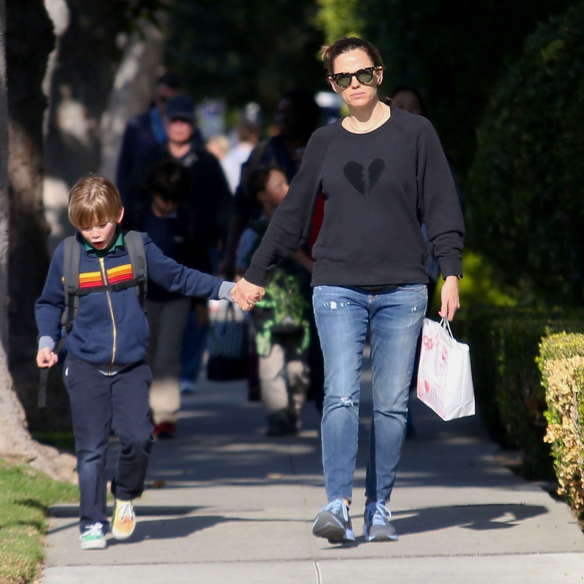 Jennifer Garner gives her son Samuel a piggyback ride after picking him up  from school in Brentwood