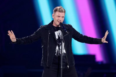 Nick Carter on Stage in a Black Suit