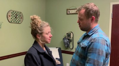 abbie and john duggar at her doctor's office during labor